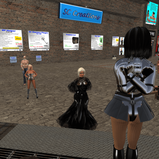 May 27th, Day 5: Jenny tied up in "Mannequin mode" at Lochme - Dio inspecting her own work