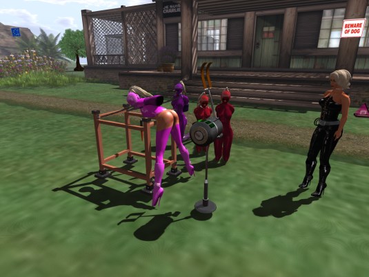 June 7th: slave Adarra on the spanking machine, slaves cecy, Gebby and Flo watching.