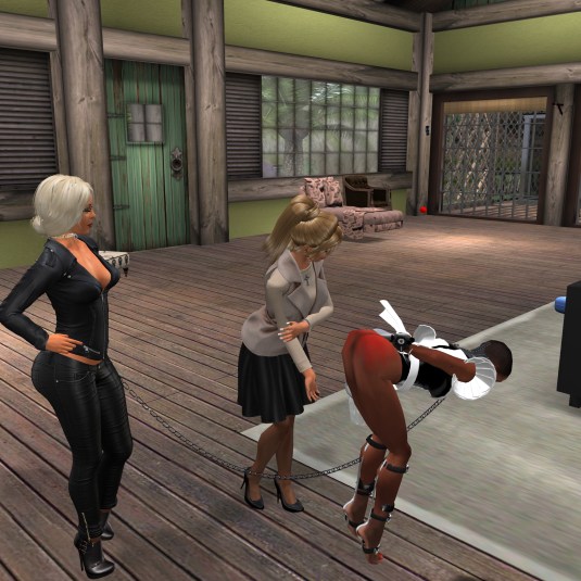 November 27th: Angelique adds some more smacks on slave Flo's bum after the punishment